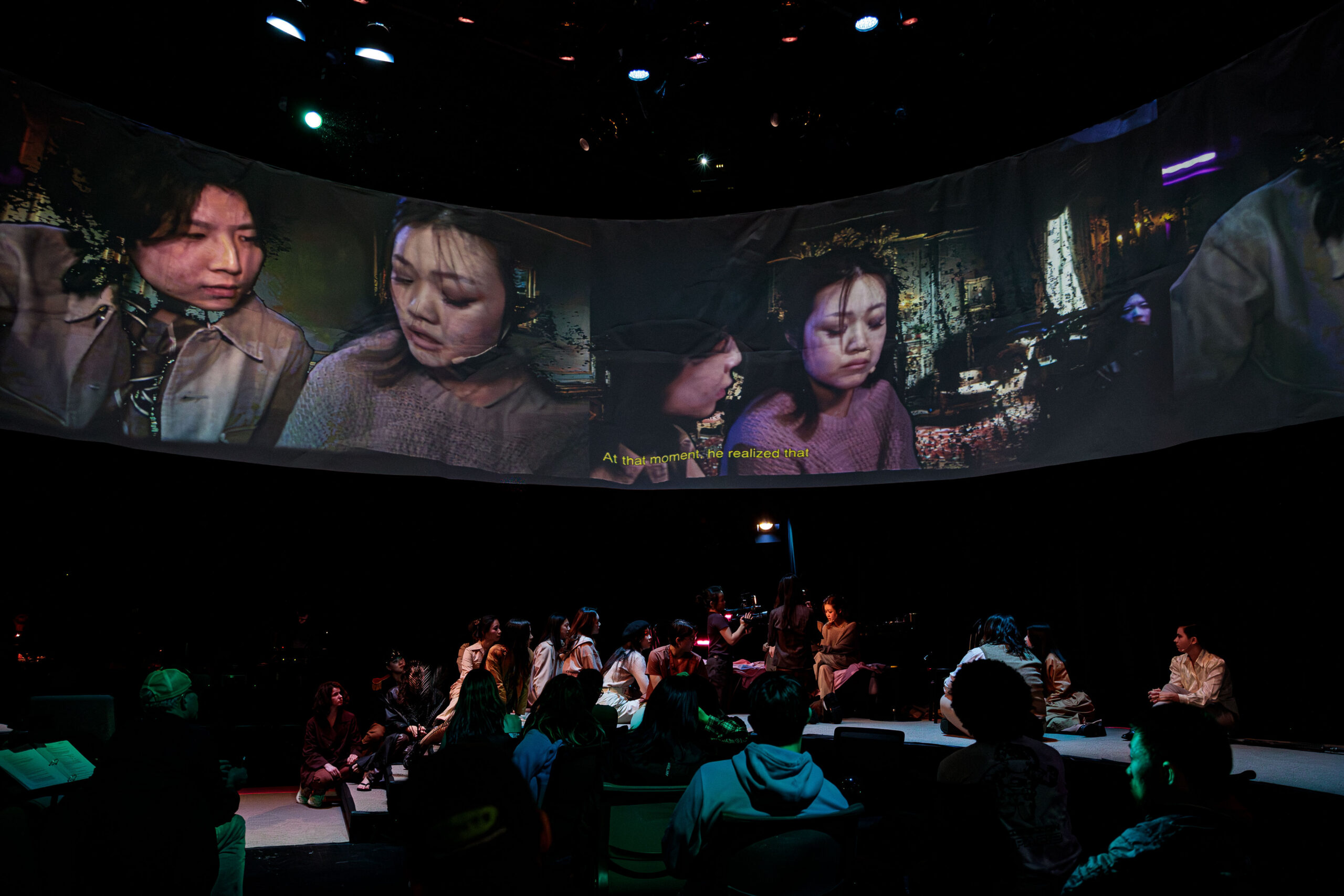 Production photo from A Dream Like a Dream where projection says 