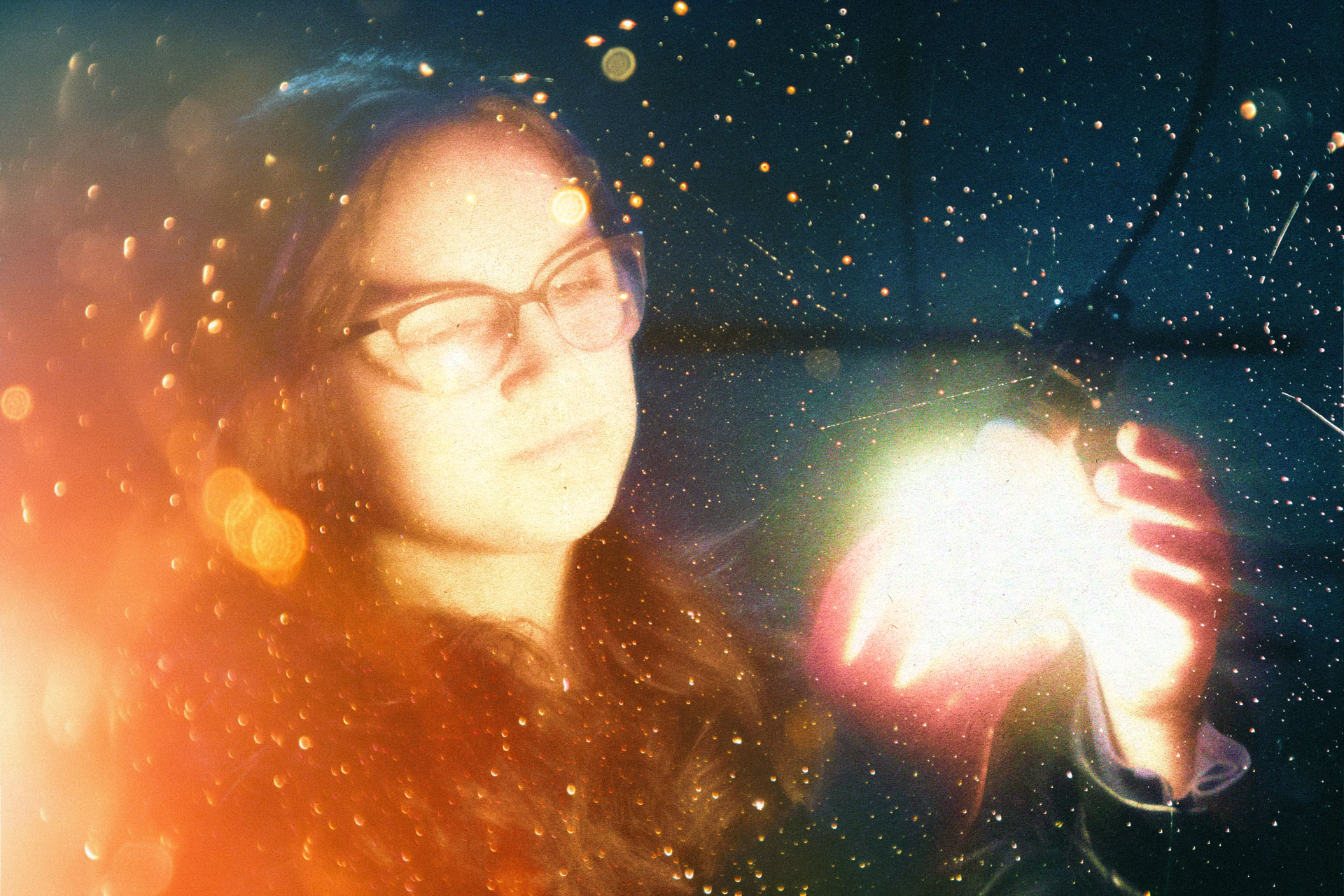 Student marveling at a light bulb.